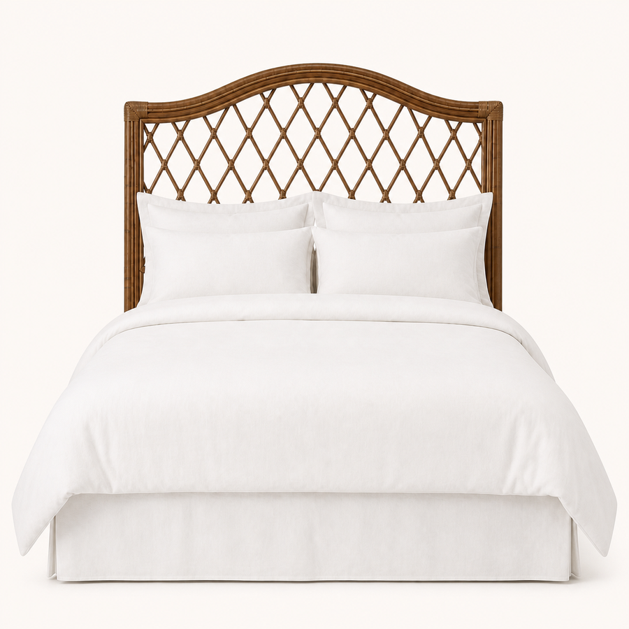 Front | Straight-on studio view of the arched rattan headboard with open diamond lattice