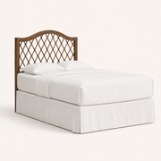 Studio | Three-quarter studio view showing the headboard's slim profile and curved top