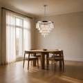 Scale | the chandelier hanging beside a floor-to-ceiling window for true size
