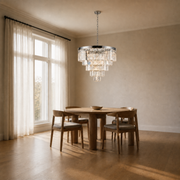 Scale | the chandelier hanging beside a floor-to-ceiling window for true size