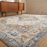 Angle | blackdown Oriental Grey rug from a low angle, grey border and faded medallion in daylight