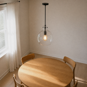 Angle | a second dining-room view looking down across the table at the pendant