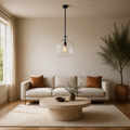 In a living room | the same pendant hanging over a travertine coffee table