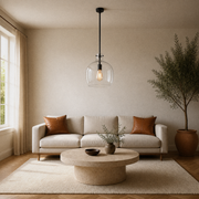In a living room | the same pendant hanging over a travertine coffee table