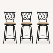 Front | all three matching gold-brown swivel stools centered on paper, oval iron lattice backs and round footrest rings