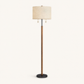 Front | studio front of the beige linen drum shade, wood stem, and black base