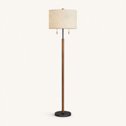 Front | studio front of the beige linen drum shade, wood stem, and black base