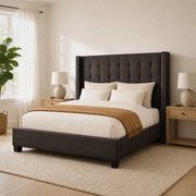 Airy corner | Three-quarter dark gray bed beside a window, with light wood nightstands, a plant, and a textured rug