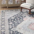 Living room | the rug shown near a mirrored cabinet and reading chair