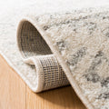 Rolled corner | rug rolled back to show pile depth and woven backing