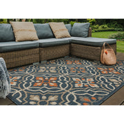 Outdoor deck | the rug shown on a wood deck with wicker outdoor seating