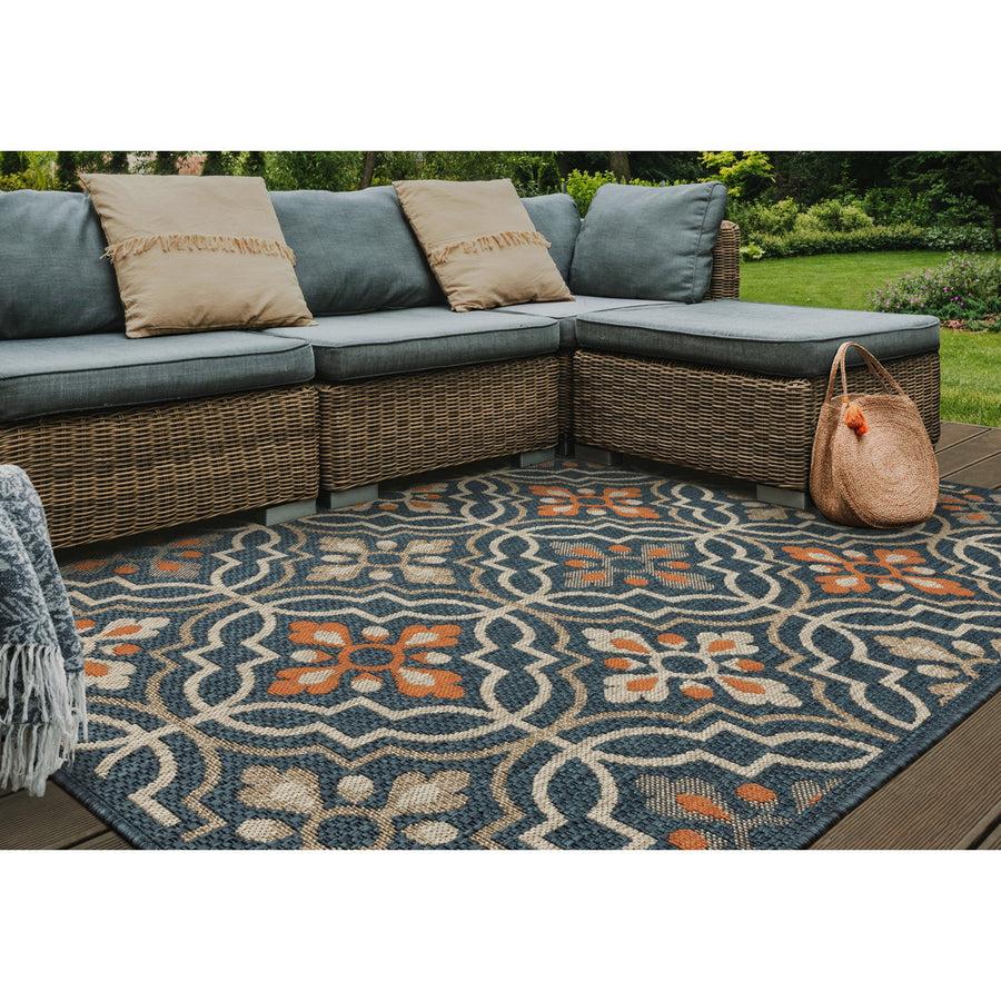 Outdoor deck | the rug shown on a wood deck with wicker outdoor seating