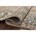 Corner roll | rug rolled back to show pile thickness and backing