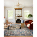 Weaver area rug in a formal living room with a marble fireplace