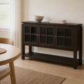Angle | same flax dining room, sideboard at a true three-quarter so the doors and open shelf both read
