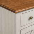Texture | close-up where the honey-walnut wood top meets the pale saw-cut-off-white case