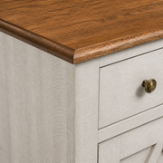 Texture | close-up where the honey-walnut wood top meets the pale saw-cut-off-white case