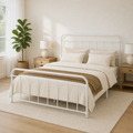 Airy corner | White bed viewed from the front corner with a plant, window light, and rug