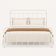 Front | White metal spindle bed shown straight on against a pale background