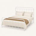 Studio | Three-quarter view of the white bed frame showing the open headboard and footboard