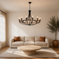Living room | the chandelier hung above a sofa and round stone coffee table