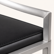 Detail | the brushed stainless joint where the low back rail meets the seat corner