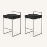 Studio | both stools at a true three-quarter studio angle, the low back rail and straight legs both reading