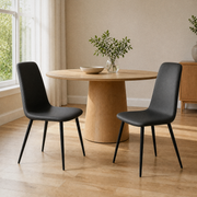 In a room | the pair pulled up to a table in a bright dining room, midday light from the left