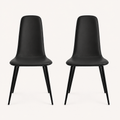 Front | both midnight-black vegan-leather dining chairs centered side by side on paper, armless shells and metal legs