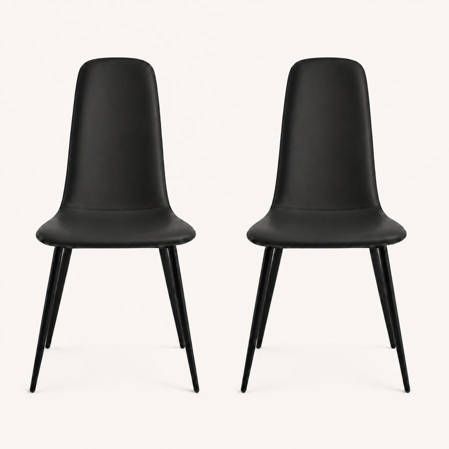 Front | both midnight-black vegan-leather dining chairs centered side by side on paper, armless shells and metal legs