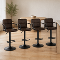 In a room | all four matching stools at a warm oak dining room's island edge, soft morning sidelight from the left