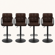 Front | all four matching stools centered on paper, square-tufted leather and the swivel pedestal base visible