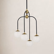 Chandelier, 4-Light Frosted Glass Orbs in Matte Black with Brass Accents