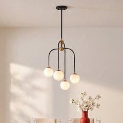 Chandelier, 4-Light Frosted Glass Orbs in Matte Black with Brass Accents