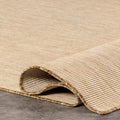 Folded corner | one corner turned back to show the pile and backing