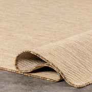 Folded corner | one corner turned back to show the pile and backing