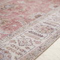 Texture | close view of the low woven pile and the ivory border motifs