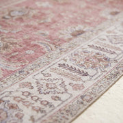 Texture | close view of the low woven pile and the ivory border motifs