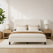 Angled bed view | Beige upholstered bed showing the channelled headboard and matching footboard