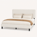 Fabric detail | Close view of the bed's textured beige chenille upholstery and channelled headboard