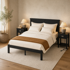 Room 1 angle | Three-quarter view of the black bed frame, upholstered panels, and two nightstands