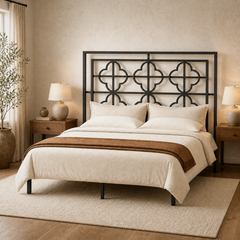 Room 1 angle | Three-quarter bedroom view showing the repeating quatrefoil lattice and slim iron profile