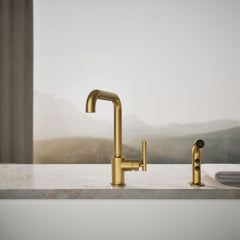 Kohler Purist Two-Hole Kitchen Sink Faucet with 8" Spout and Matching Finish Sidespray in Vibrant Brushed Moderne Brass | product photo