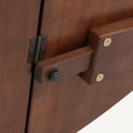 Hardware | close-up on one underside hinge and its wood support bracket that holds a leaf level