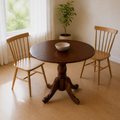 Angle | same dining room, table rotated a genuine 45 degrees from the hero so the chairs trade places and the pedestal reads from a new side