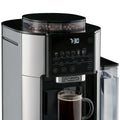 Detail | Coffee beans in the TrueBrew built-in grinder hopper above the control panel and brewing mug