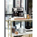Lifestyle | combo brewer on a bar cart by a city window with espresso and latte