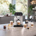 Lifestyle | Eletta Explore machine on a kitchen island with a full lineup of hot and iced coffee drinks