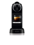 Detail | Nespresso CitiZ espresso machine in black, front view brewing a cup of espresso into a glass cup