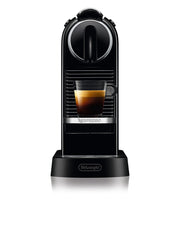Detail | Nespresso CitiZ espresso machine in black, front view brewing a cup of espresso into a glass cup